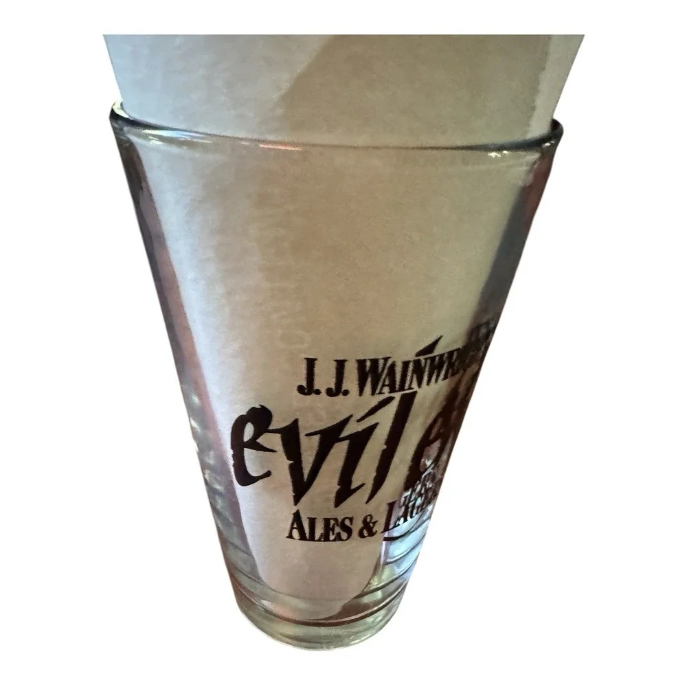 JJ Wainwrights Evil Eye Ales & Lagers Beer Pint Glass Vintage Black Logo Barware